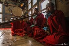 Playing a musical instrument during a puja