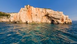 Entrance of the Blue Caves at the foot of Skinari and Potamitis Windmills