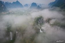 Clouds above waterfall