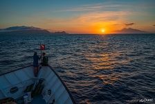 Seeing the sunset on board