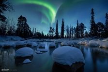 Northern lights over a non-freezing river