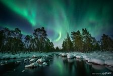 Northern lights over a non-freezing river