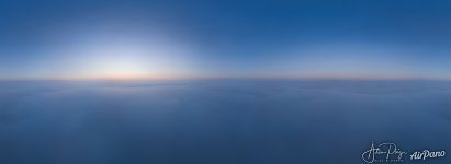 The rising Sun and the setting Moon above thick fog